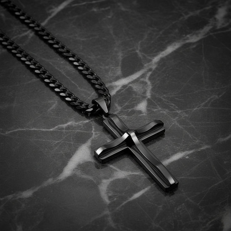 Black cross necklace on dark marble