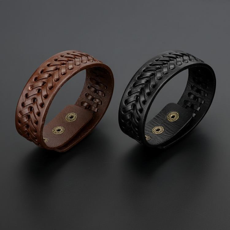 Brown and black leather bracelets on black table