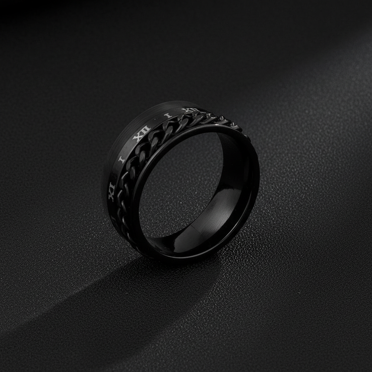 Close-up of black Roman numeral ring