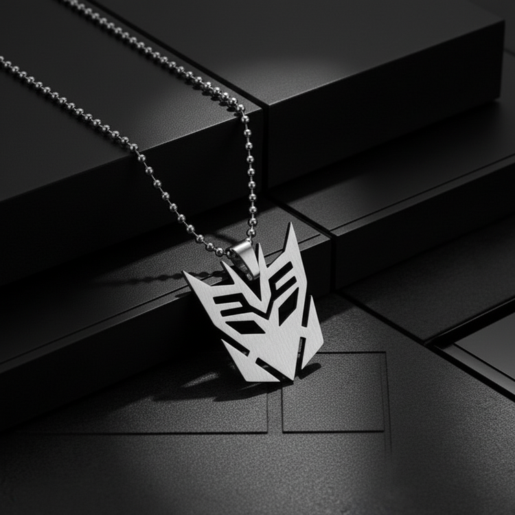 Close-up of Decepticon necklace with dark geometric background