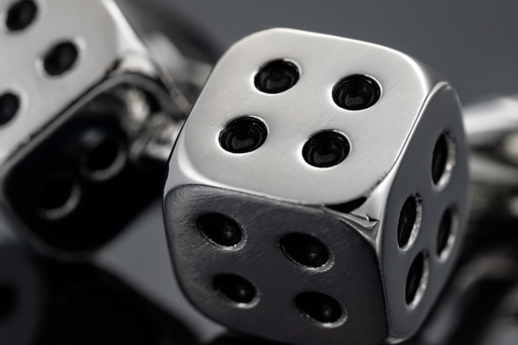 Extreme close-up of silver dice cufflinks showing premium craftsmanship and detail