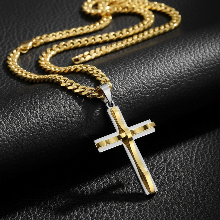 Gold and silver cross necklace on black leather