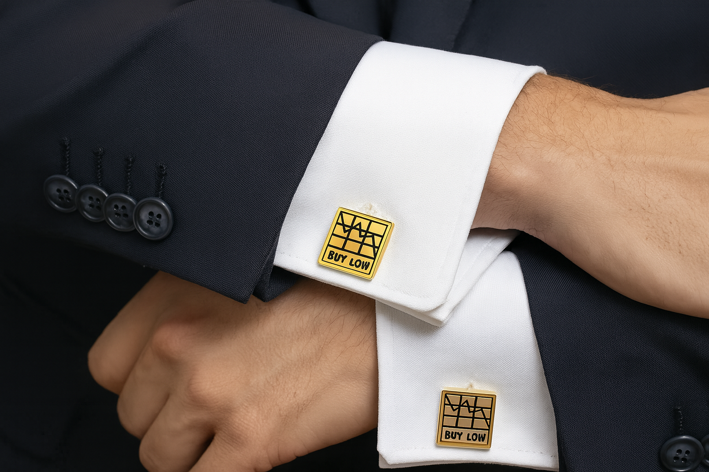 Gold "BUY LOW" trading cufflinks on navy suit