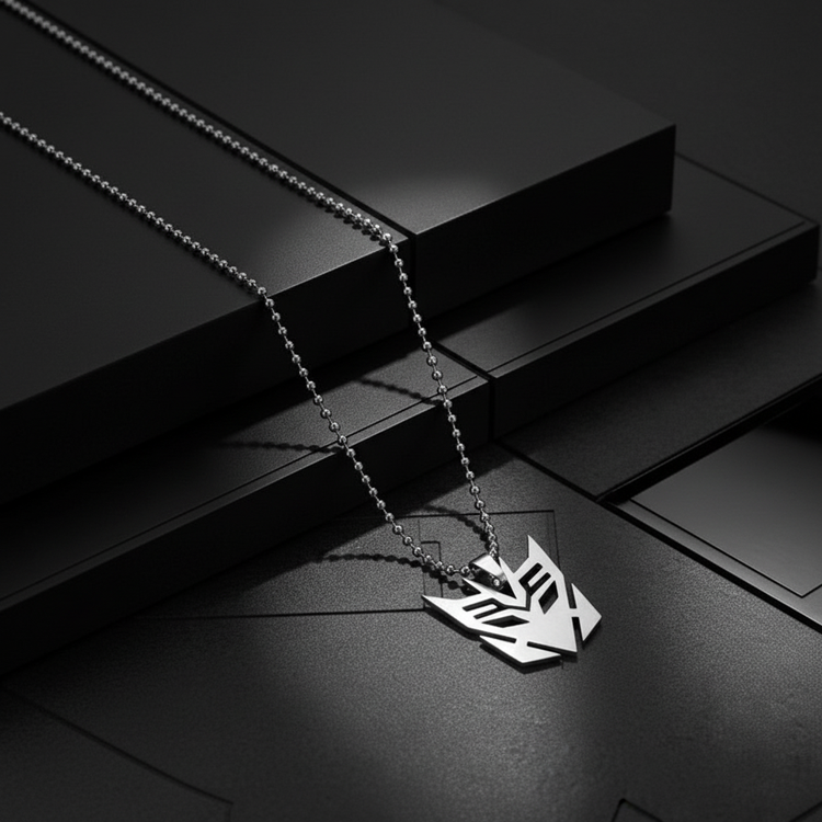 Separate Decepticon necklace images with dark geometric backgrounds