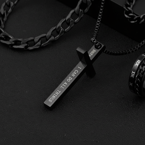Side view of cross pendant with engraved text
