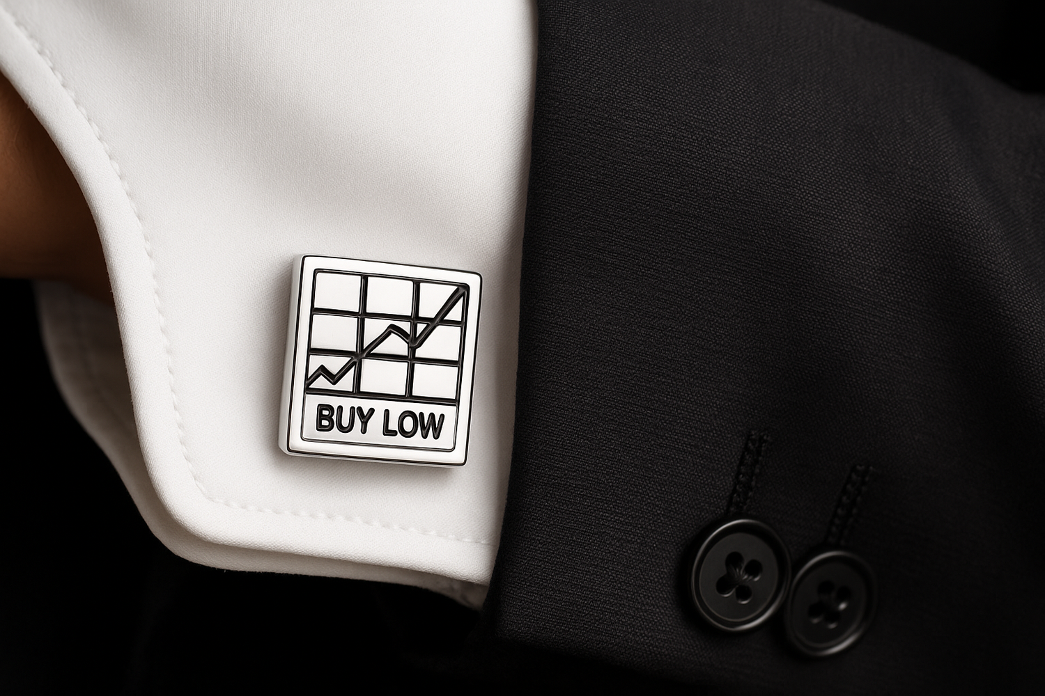 Silver BUY LOW cufflink worn on dress shirt cuff