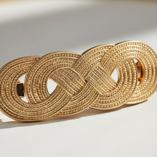 Super close-up macro shot of the gold chain belt buckle details