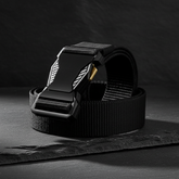 Black tactical belt on slate stone