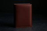Burgundy wallet on granite