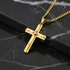 Close-up detail of gold cross pendant