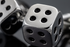 Extreme close-up of silver dice cufflinks showing premium craftsmanship and detail