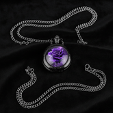 Flat lay purple rose watch