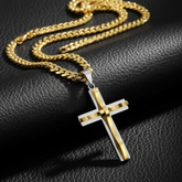 Gold and silver cross necklace on black leather