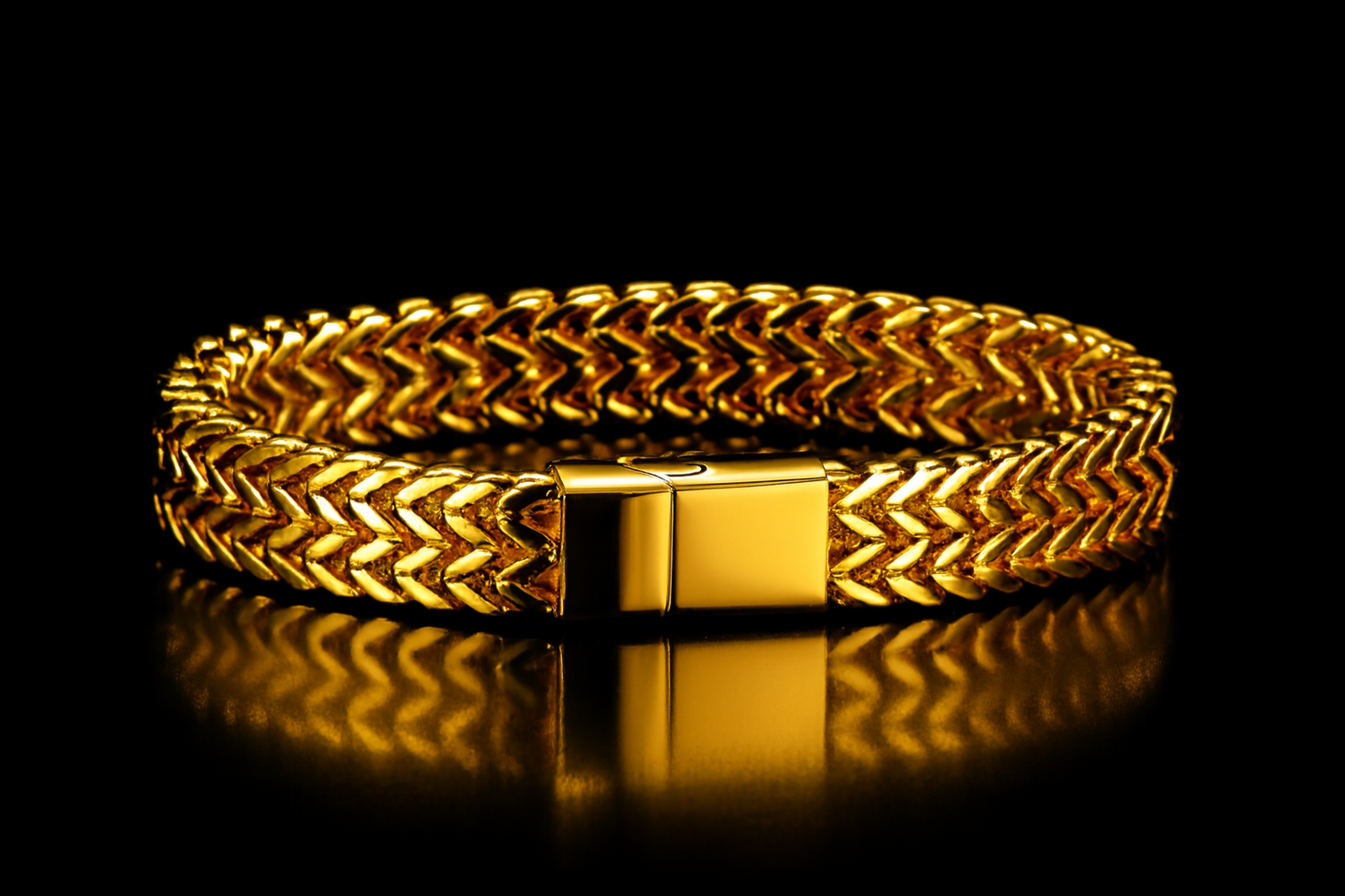 Gold bracelet on black background with shiny table surface