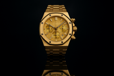 Gold watch with gold dial - dramatic reflection