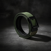 Olive green tactical belt on dark concrete surface