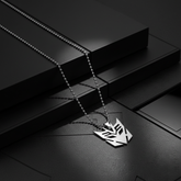 Separate Decepticon necklace images with dark geometric backgrounds
