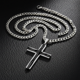 Silver and black cross necklace on black leather