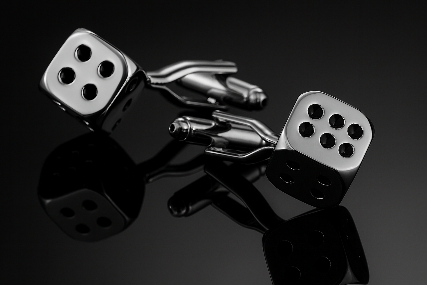 Silver dice cufflinks dramatic low angle perspective