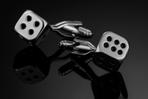 Silver dice cufflinks dramatic low angle perspective