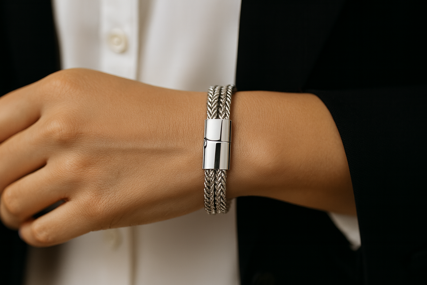 Silver double chevron chain bracelet on woman's wrist with exact reference proportions