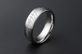 Silver ring with moderate dark background