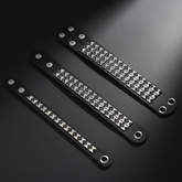 Three bracelets on dark background