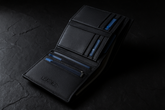 Wallet on dark stone surface