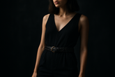 Woman wearing black braided belt with modern edgy outfit